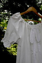 Load image into Gallery viewer, White one size, plus size, heirloom lace smock top with lace details on a wooden hanger against a natural background